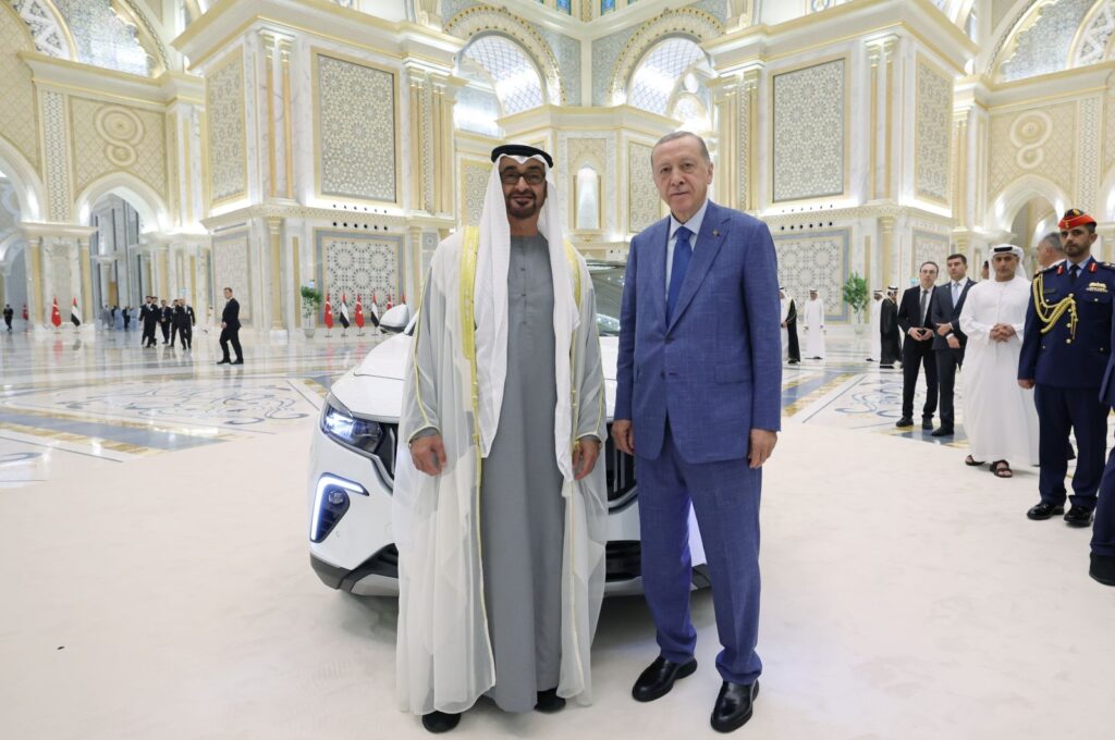 President Recep Tayyip Erdoğan (R) and United Arab Emirates (UAE) President Sheikh Mohammed bin Zayed Al Nahyan pose in front of Togg in Abu Dhabi, UAE, July 19, 2023. (DHA Photo)
