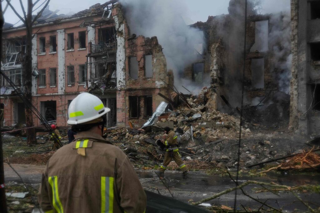 A Ukrainian rescuer looks towards a destroyed residential building after a missile strike in the center of Mykolaiv, Ukraine, July 20, 2023. (AFP Photo)