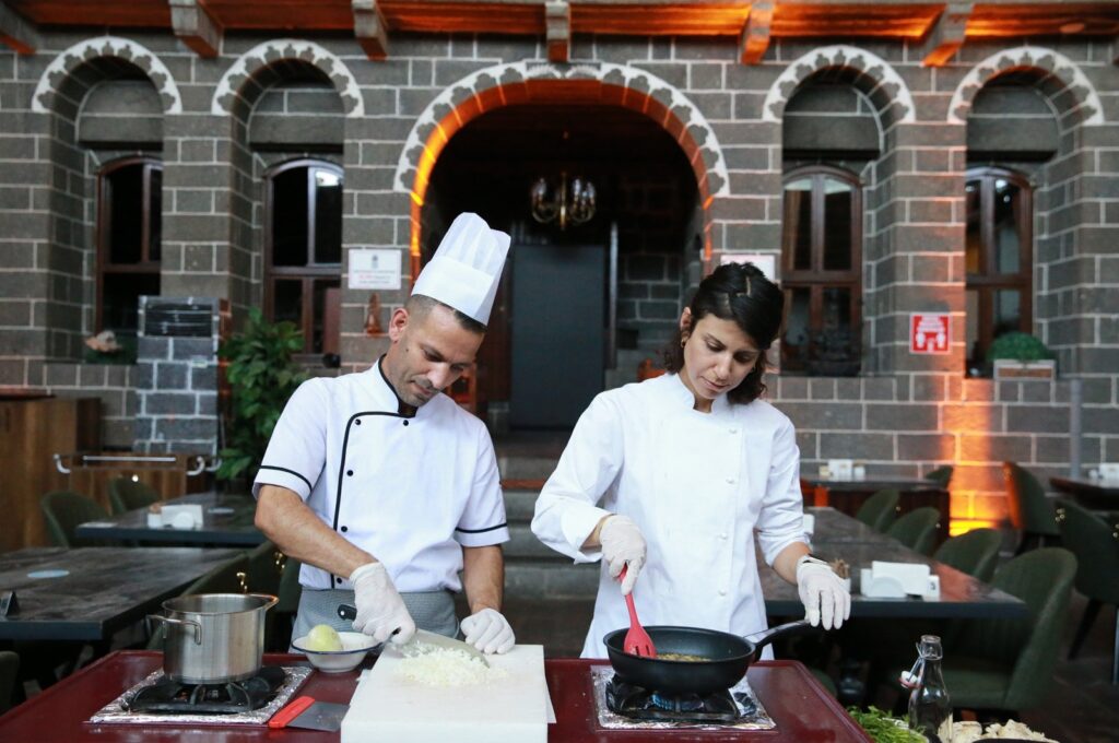 History teacher Zeynep Olgun (R) prepares vegan versions of traditional dishes, in Diyarbakır, Türkiye, July 17, 2023. (AA Photo)
