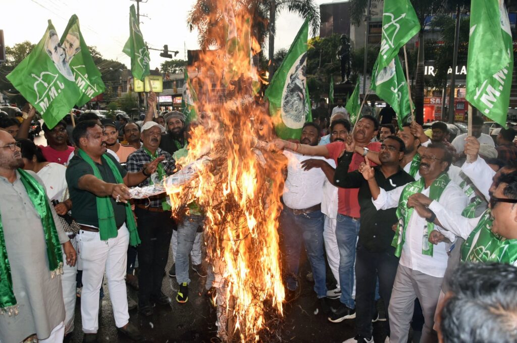 Jharkhand Mukhti Morcha (JMM) supporters burn an effigy during a protest over two women being allegedly raped and paraded naked in Manipur, at Albert Ekka Chowk, Ranchi, India, July 20, 2023. (Reuters Photo)