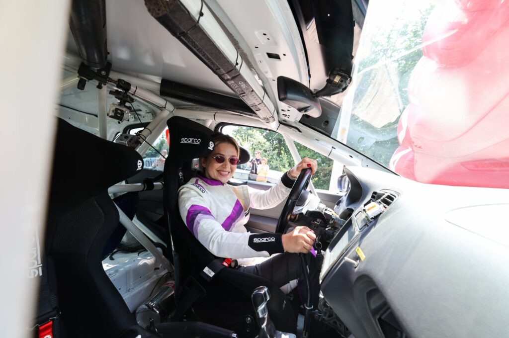 Turkish special motorsports rider Kübra Denizci poses for a photo in a car, Bursa, Türkiye, July 23, 2023. (IHA Photo)