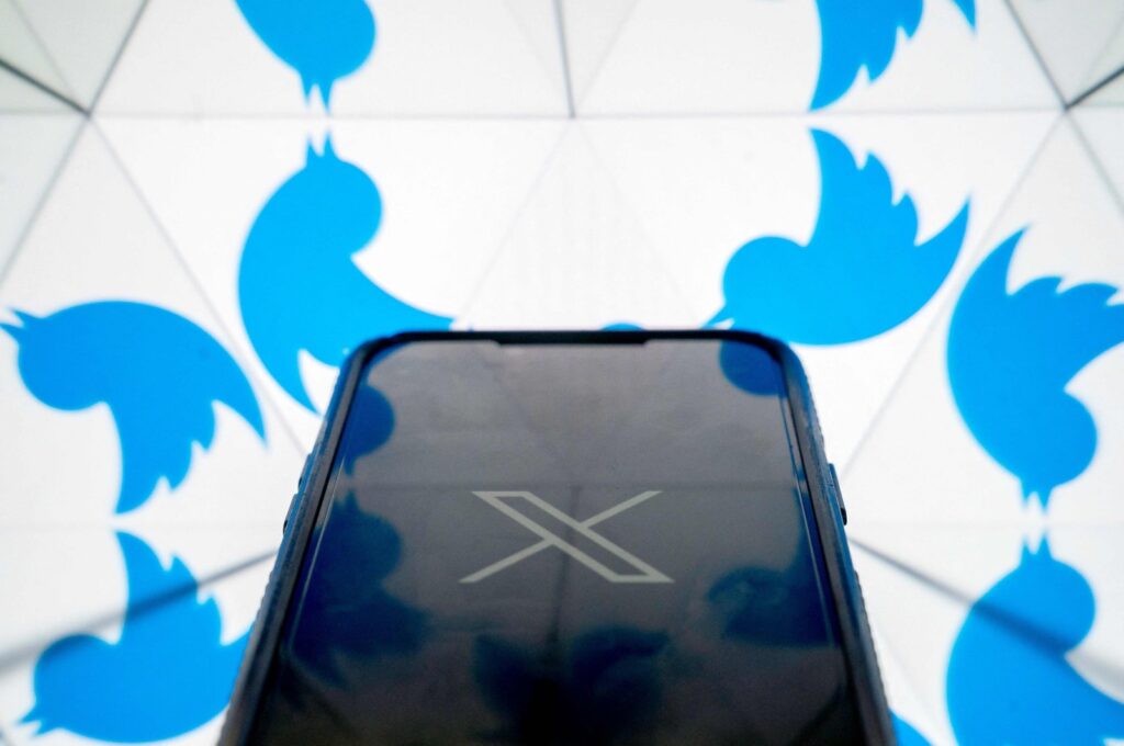 The new X Twitter logo is seen in front of the bird Twitter logo in this illustration photo created in Washington, D.C., U.S., July 24, 2023. (AFP Photo)
