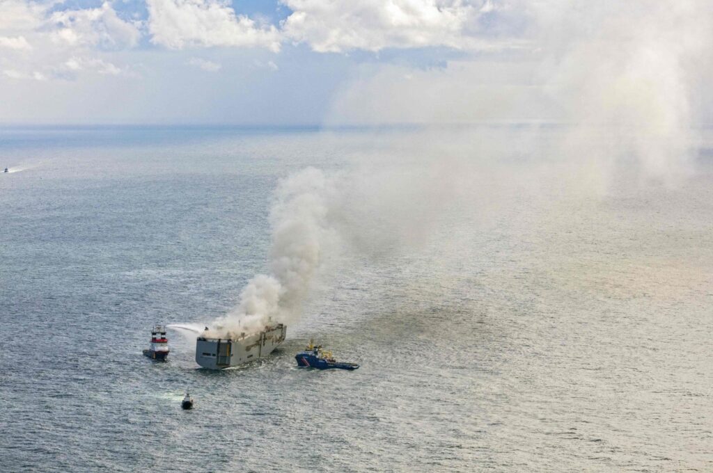 This aerial photograph shows emergency boats extinguishing a fire aboard the Panamanian-registered car carrier cargo ship Fremantle Highway, off the coast of the northern Dutch island of Ameland. (AFP Photo)