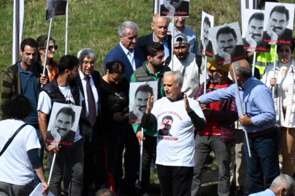 Zübeyir Aydar (third left, in a suit) and Adem Uzun (center, wearing a T-shirt) attend the pro-PKK rally in Brussels, Belgium, July 26, 2023. (AA Photo)