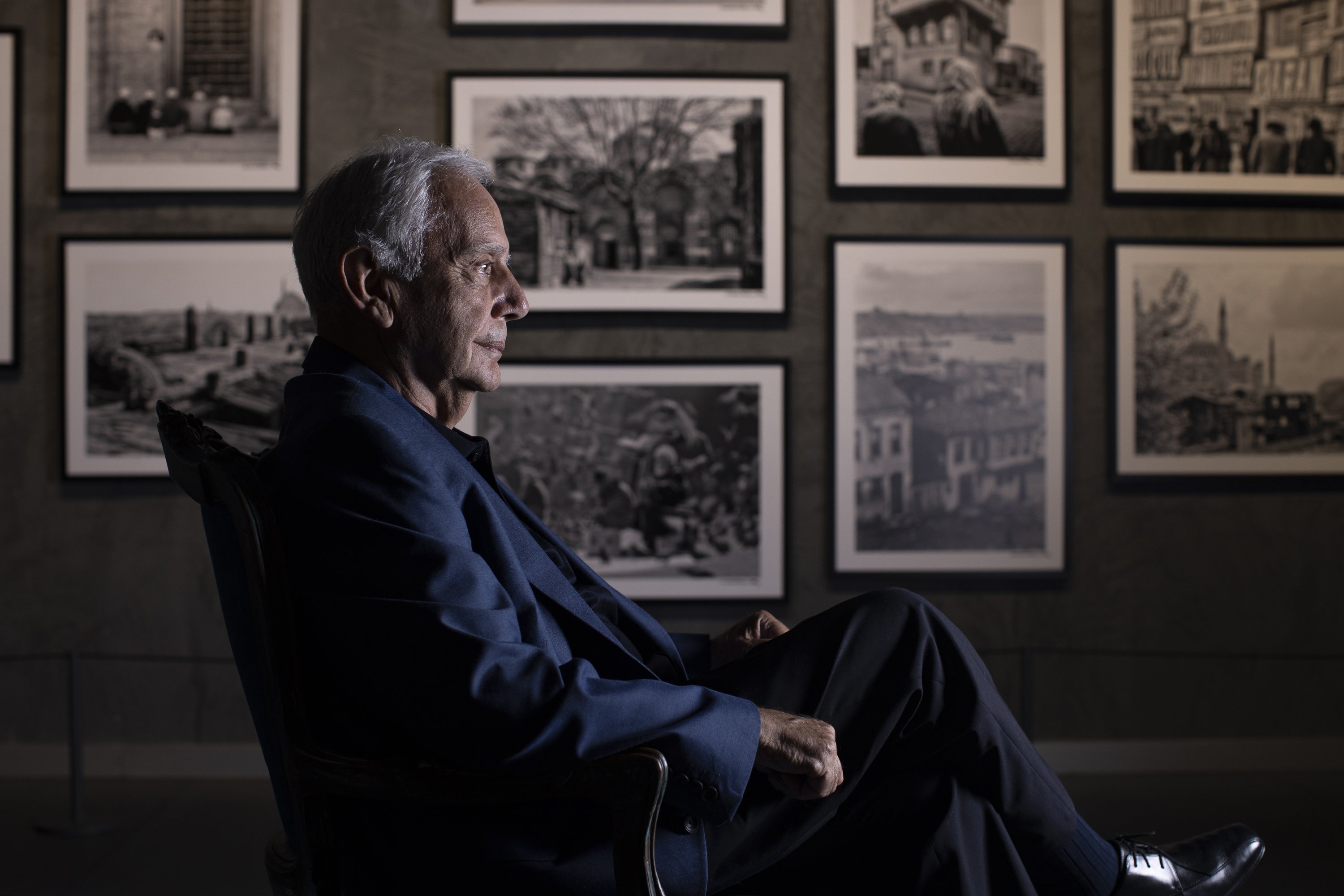 284542 Hailed photographer Izzet Keribar poses with examples of his photography, Istanbul, Türkiye, July 7, 2023. (AA Photo)