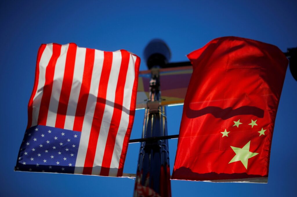 The flags of the United States and China fly from a lamppost in the Chinatown neighborhood of Boston, Massachusetts, U.S., Nov. 1, 2021. (Reuters Photo)