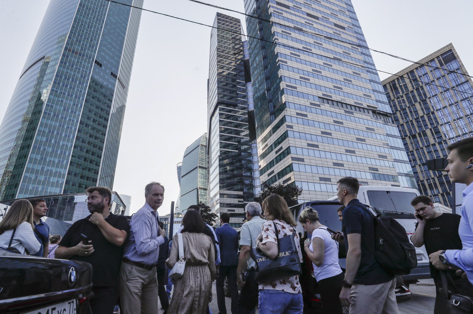 People walk near a damaged building in the Moskva-City business center following a reported drone attack in Moscow, Russia, August 1, 2023. (EPA Photo)