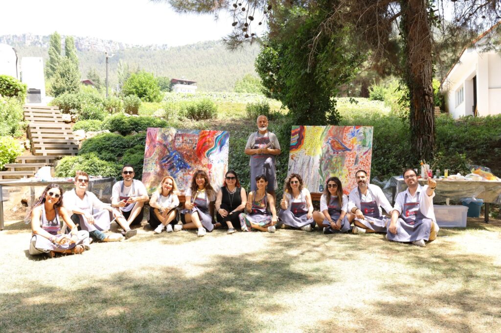The press team poses with Arnica Art Land's Artistic director and curator, the artist Denizhan Özer, Mersin, Türkiye, July 29, 2023. (Photo courtesy of Arnica Art Land)