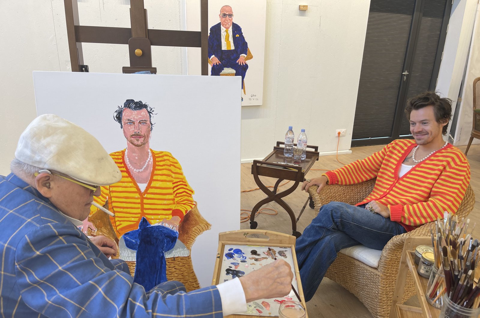 Undated handout photo issued by David Hockney of himself painting a portrait of Harry Styles which will go on display as part of "David Hockney: Drawing from Life," which opens on Nov. 2 at the National Portrait Gallery in London, U.K., Aug. 2, 2023. (dpa Photo)