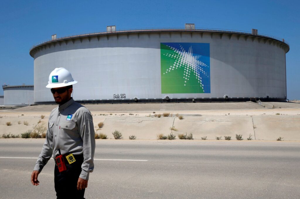 An Aramco employee walks near an oil tank at Saudi Aramco's Ras Tanura oil refinery and oil terminal in Saudi Arabia, May 21, 2018. (Reuters Photo)