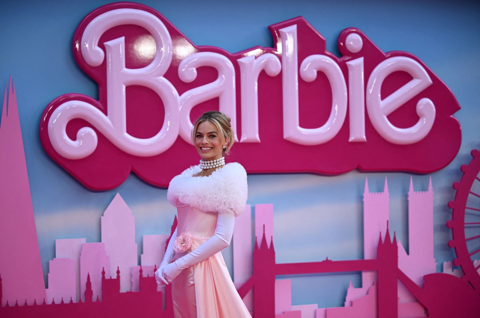 Australian actress Margot Robbie poses on the pink carpet upon arrival for the European premiere of "Barbie" in central London, U.K., July 12, 2023. (AFP Photo)
