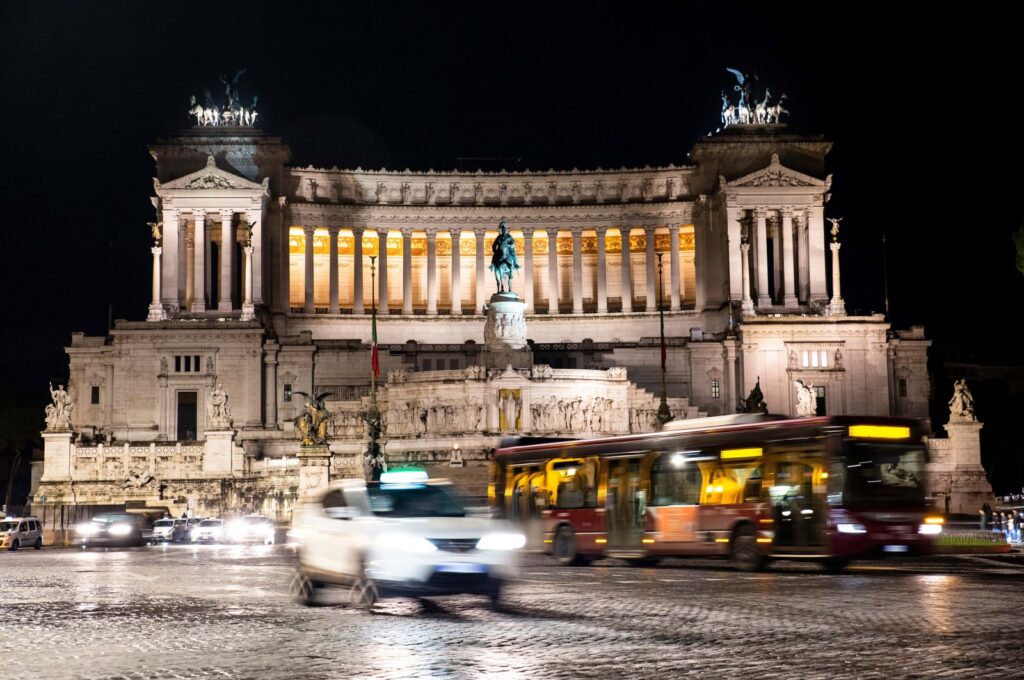 A taxi and a bus pass in front of Venice Square, Rome, Italy, Nov. 24, 2019. (Shutterstock File Photo)