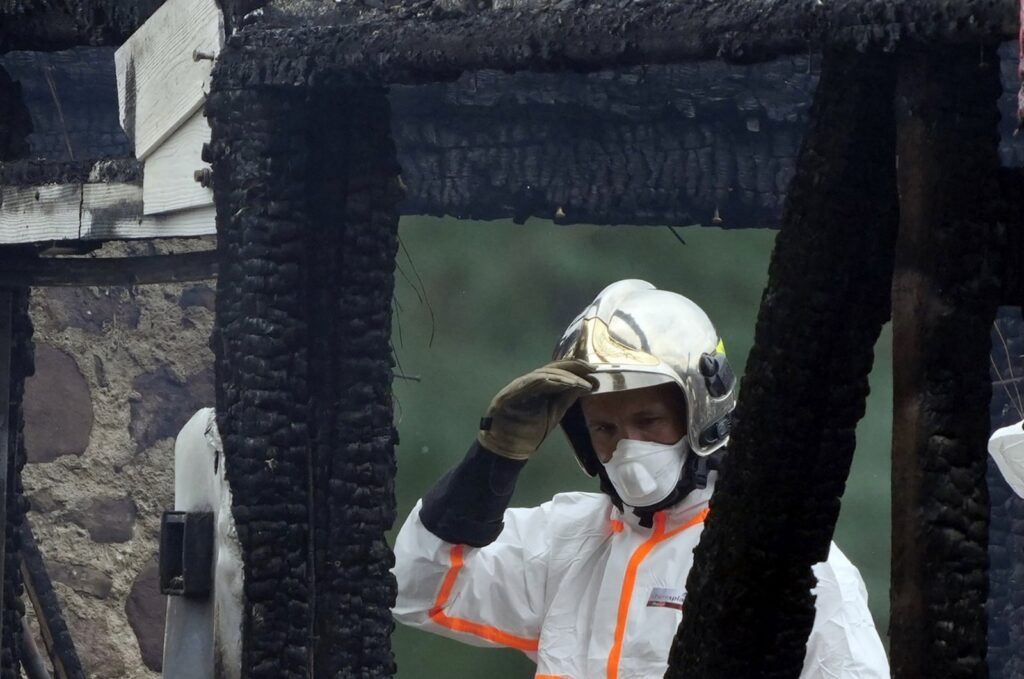 A firefighter works at the site of a burned building in Wintzenheim, north-eastern France, Aug. 9, 2023. (EPA Photo)