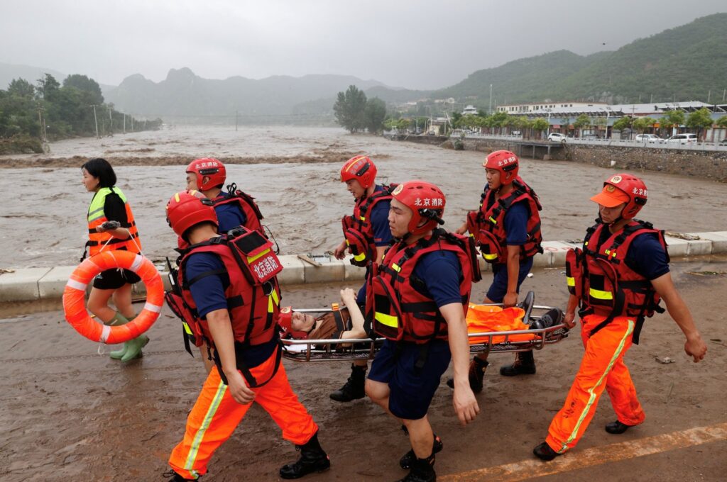 Rescue workers evacuate an elderly resident from a flood-affected village in Beijing, China, Aug. 1, 2023. (Reuters Photo)