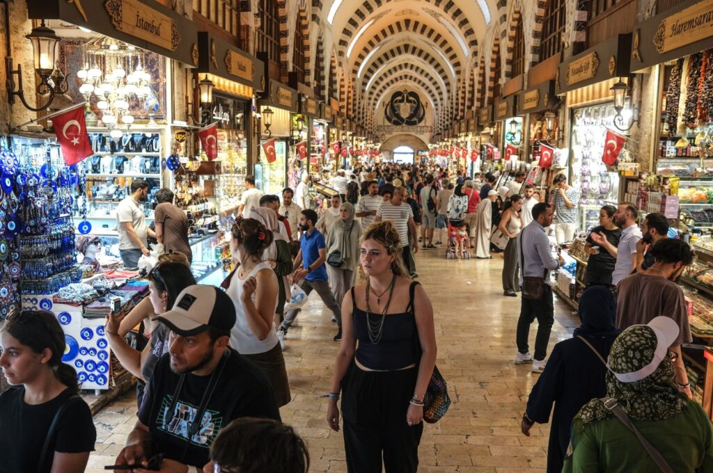 People shop at the Grand Bazaar in Istanbul, Türkiye, Aug. 3, 2023. (EPA Photo)