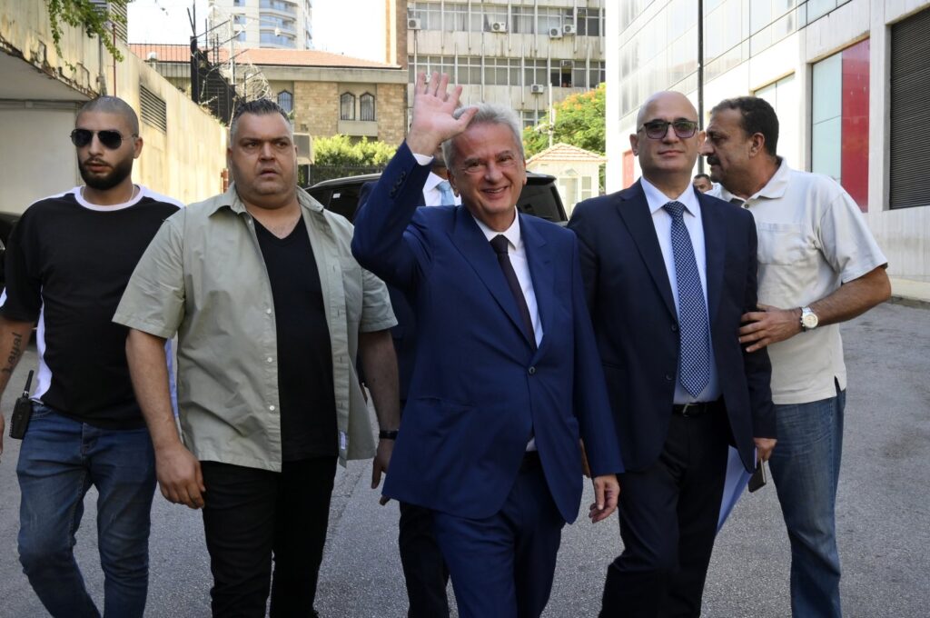 Lebanon's central bank Governor Riad Salameh (C) greets employees on his last working day in Beirut, Lebanon, July 31, 2023. (EPA Photo)