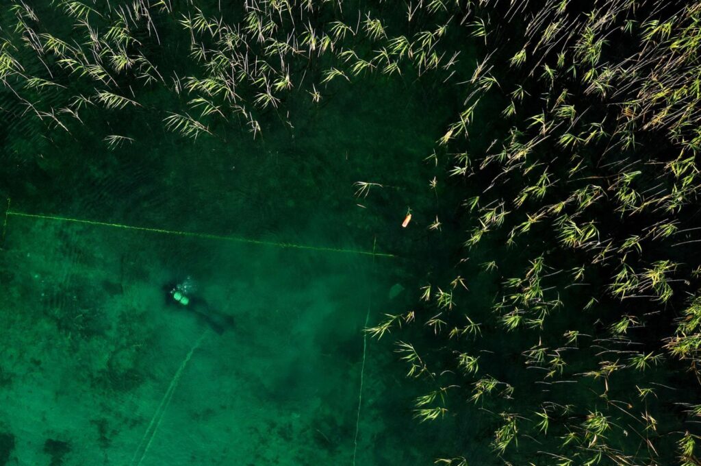 A diver searches for archaeological material in Lake Ohrid, southeastern Albania, July 27, 2023. (AFP Photo)