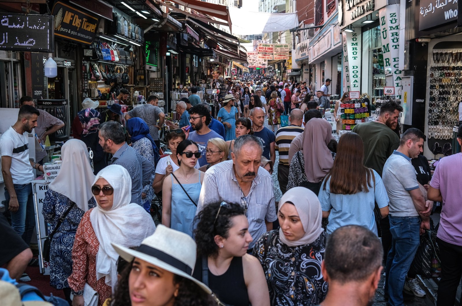 People walk through the old city bazaar in Istanbul, Türkiye, Aug. 3, 2023. (EPA Photo)