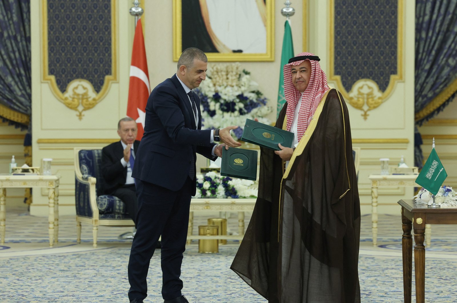 Turkish drone maker Baykar CEO Haluk Bayraktar and Khaled bin Hussein Al Bayari, Saudi assistant minister of Defense for Executive Affairs, attend a signing ceremony in Jeddah, Saudi Arabia, July 18, 2023. (Baykar Handout via Reuters Photo)