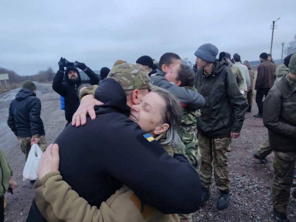 A woman embraces a Ukrainian prisoner of war after a swap, amid Russia's attack on Ukraine in an undisclosed location, Ukraine, Dec. 31, 2022. (Reuters Photo)