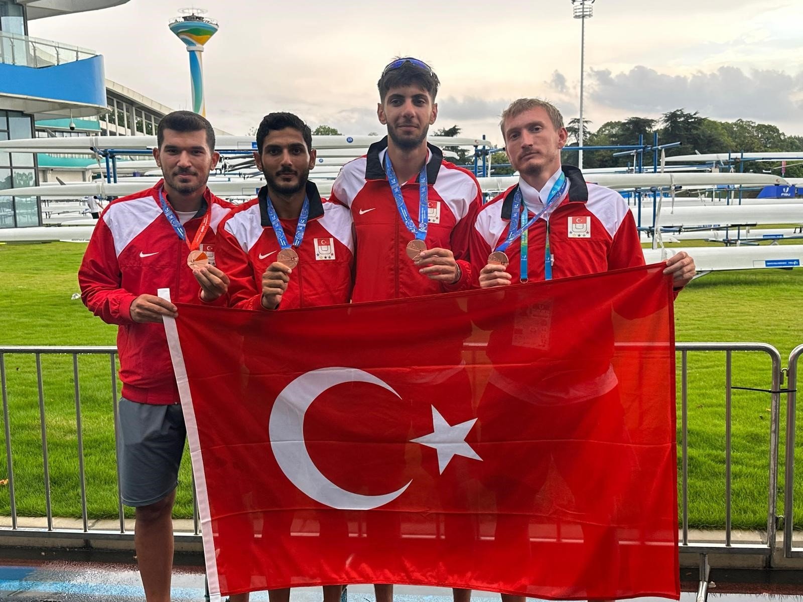 Turkish rowers pose with the flag and their medals after winning at the Under-23 World Rowing Championships, Plovdiv, Bulgaria, Aug. 6, 2023. (IHA Photo)