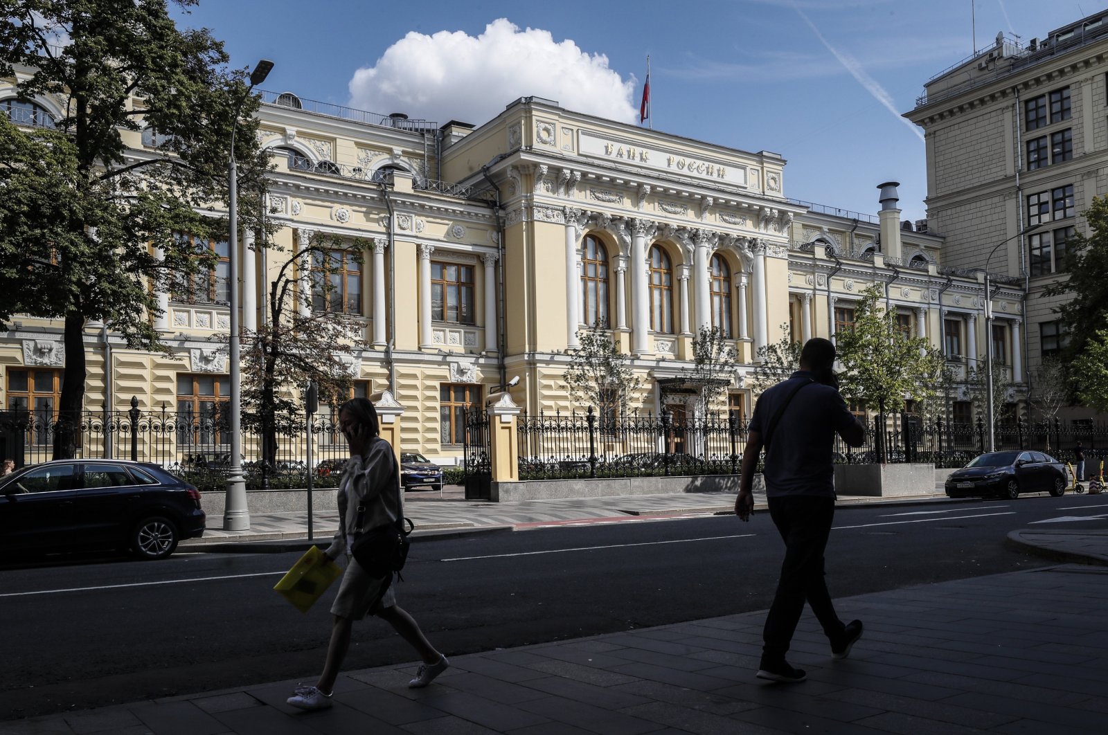 People walk past the Bank of Russia headquarters in Moscow, Russia, Aug. 1, 2023. (EPA Photo)