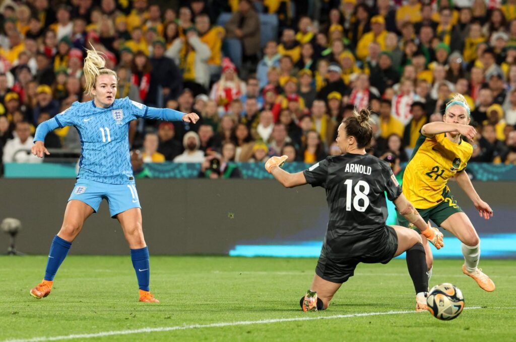 England's forward Lauren Hemp (L) scores her team's second goal past Australia's goalkeeper Mackenzie Arnold during the Women's World Cup semifinal football match at Stadium Australia, Sydney, Australia, Aug. 16, 2023. (AFP Photo)