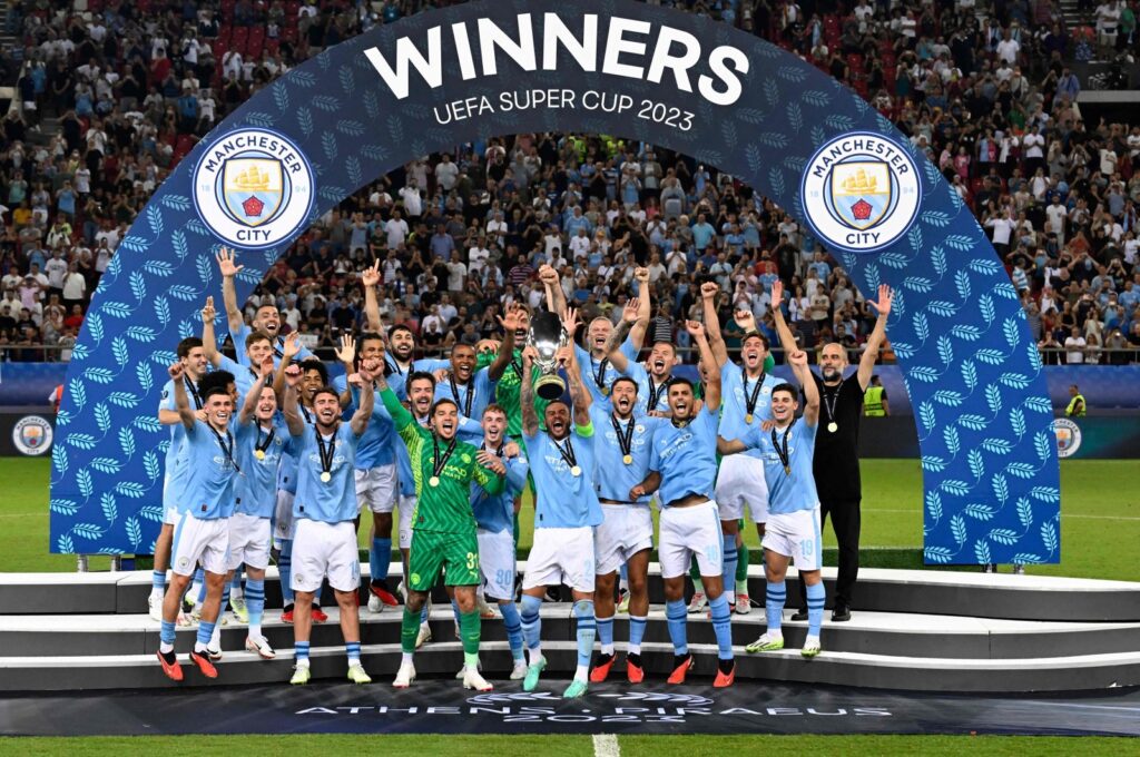 Manchester City's English defender Kyle Walker holds the trophy on the podium after winning the 2023 UEFA Super Cup football match between Manchester City and Sevilla at the Georgios Karaiskakis Stadium, Piraeus, Greece, Aug. 16, 2023. (AFP Photo)