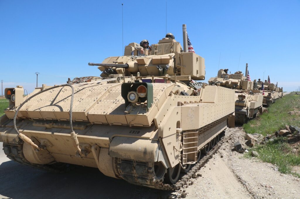 A U.S. military convoy carrying reinforcements for U.S. forces in regions controlled by the PKK/YPG terrorist group proceeds on the countryside of Deir ez-Zor, northern Syria, Aug. 15, 2023. (AA Photo)