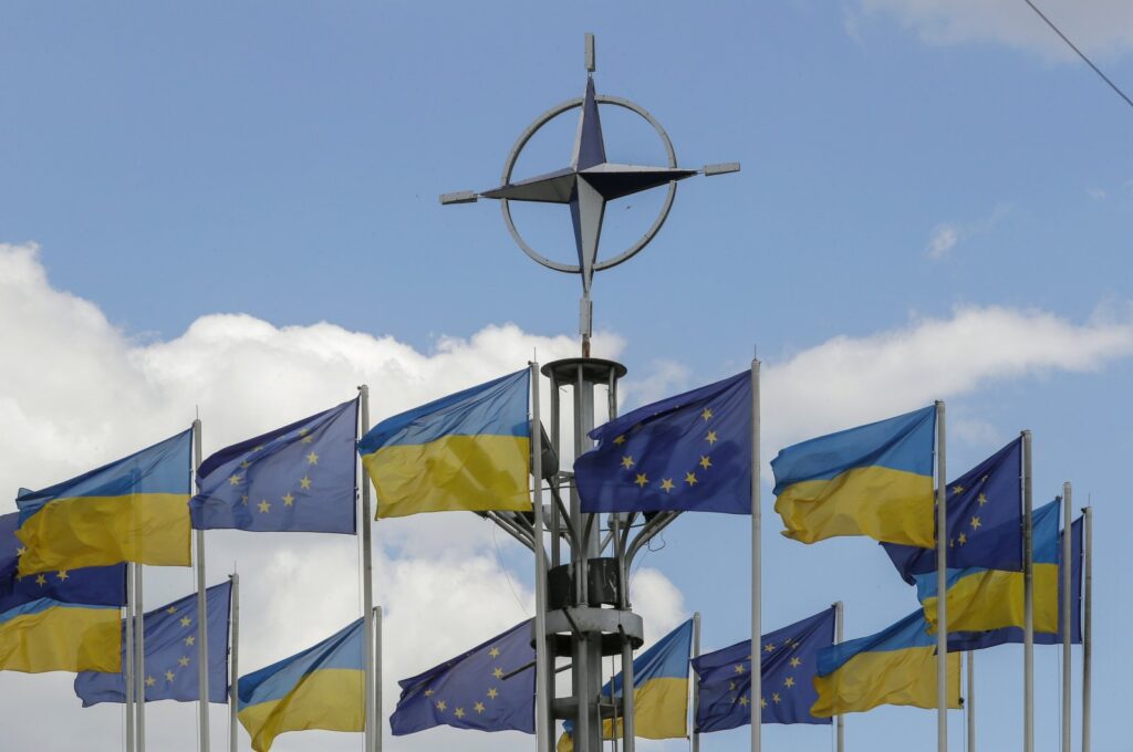 Ukraine's national flags and EU flags fly under the NATO logo in European Square amid the Russian invasion, downton Kyiv, Ukraine, July 12, 2023. (EPA Photo)