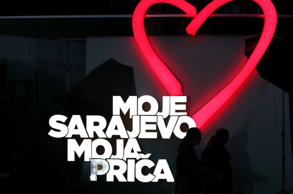 People walk in front of a poster that reads "My Sarajevo, My Story" during the closing of the 29th Sarajevo Film Festival in Sarajevo, Bosnia and Herzegovina, Aug. 18, 2023. (EPA Photo)