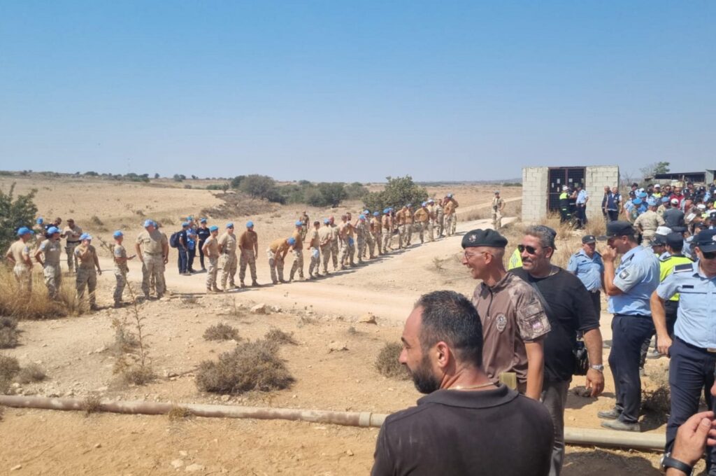 Turkish Cypriot security forces and U.N. peacekeepers stand at the site in the buffer zone, the island of Cyprus, Aug. 18, 2023. (AA Photo)