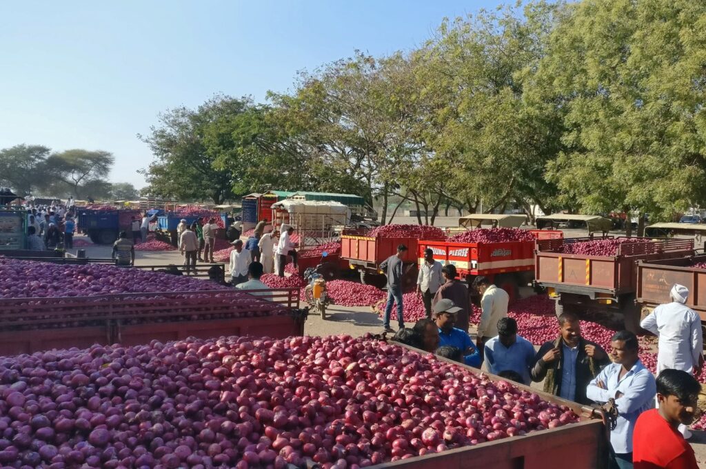 Farmers wait for the auction of onions at Lasalgaon market in Nashik district in the western state of Maharashtra, India, Dec. 19, 2018. (Reuters Photo)