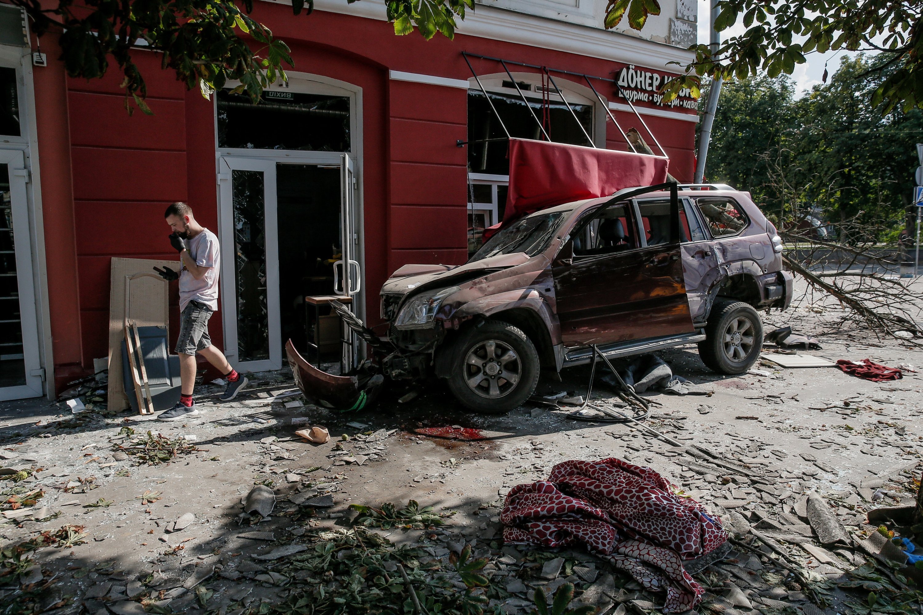288181 A crashed car at the site where a missile hit the Drama Theatre in central Chernihiv, Ukraine, Aug. 19, 2023. (EPA Photo)