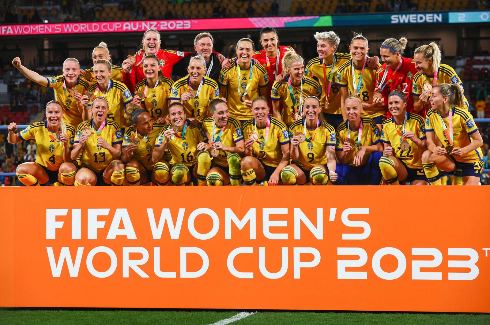 Sweden players celebrate with their bronze medals after winning the Australia and New Zealand 2023 Women's World Cup third place playoff football match between Sweden and Australia at Brisbane Stadium, Brisbane, Australia, Aug. 19, 2023. (AFP Photo)