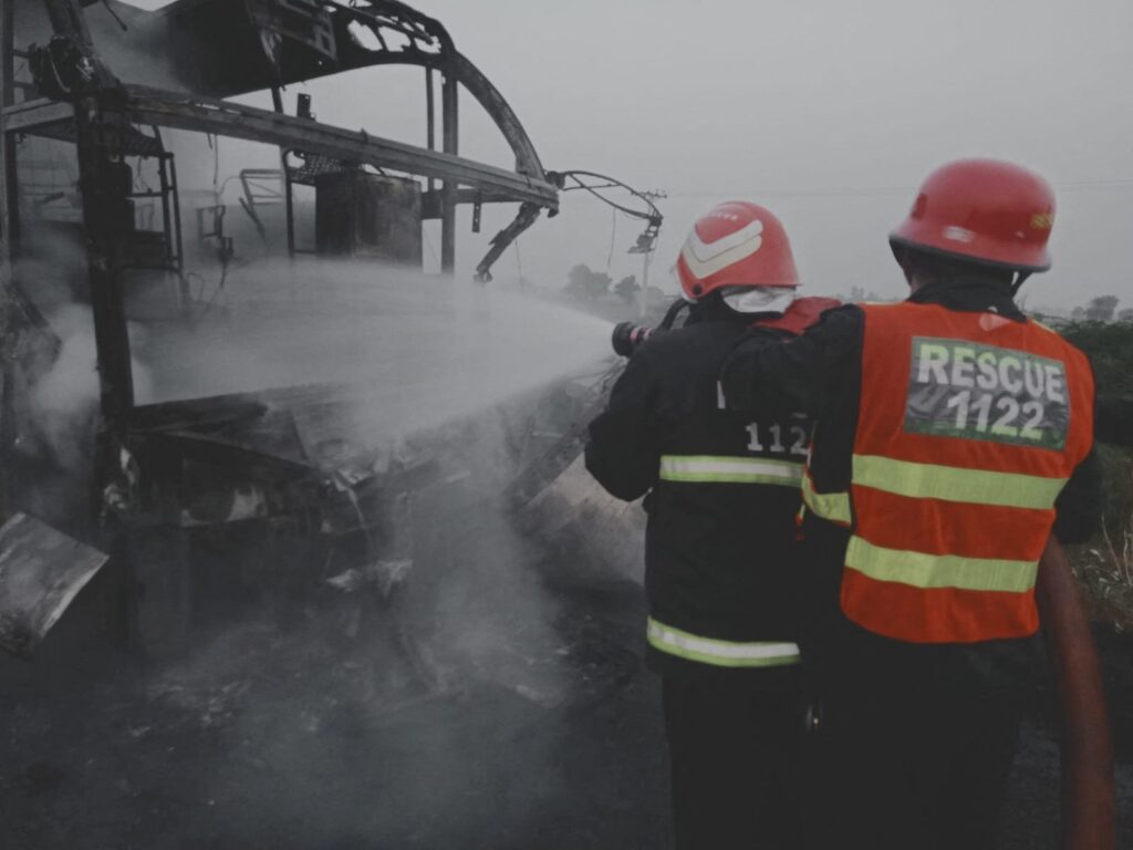 Rescuers work after a bus crashed and caught fire in Pindi Bhattian, Punjab, Pakistan, Aug. 20, 2023. (Reuters Photo)