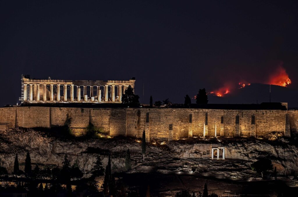 A forest burns behind the Parthenon on the outskirts of Athens, Greece, Aug. 22, 2023. (AFP Photo)