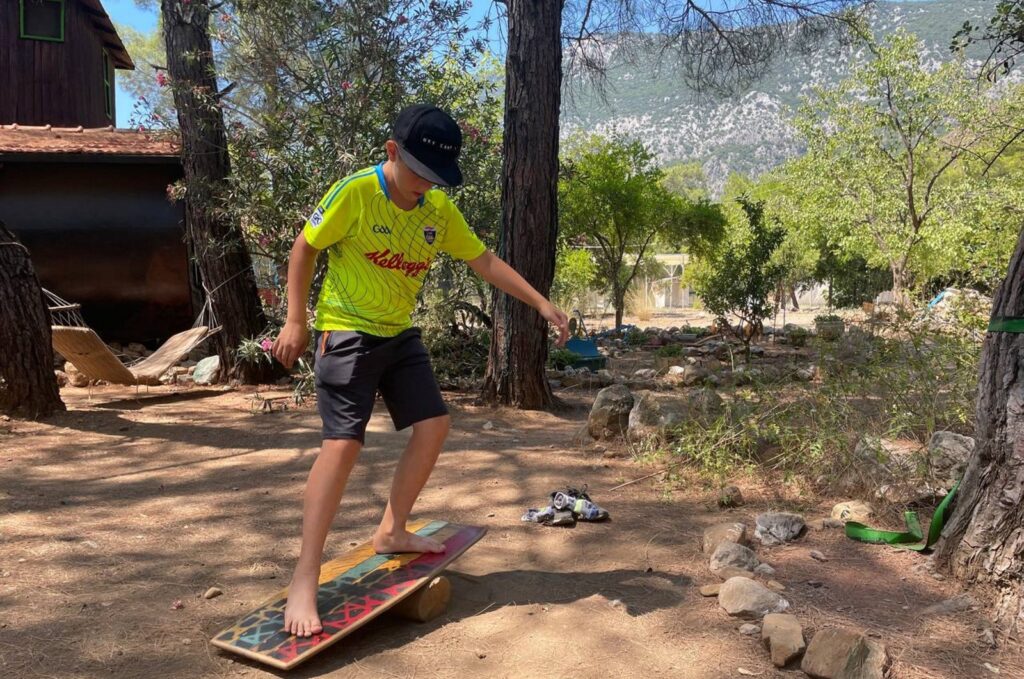 A Ukrainian child tries a balance board in Antalya, Türkiye, Aug. 24, 2023. (AA Photo)