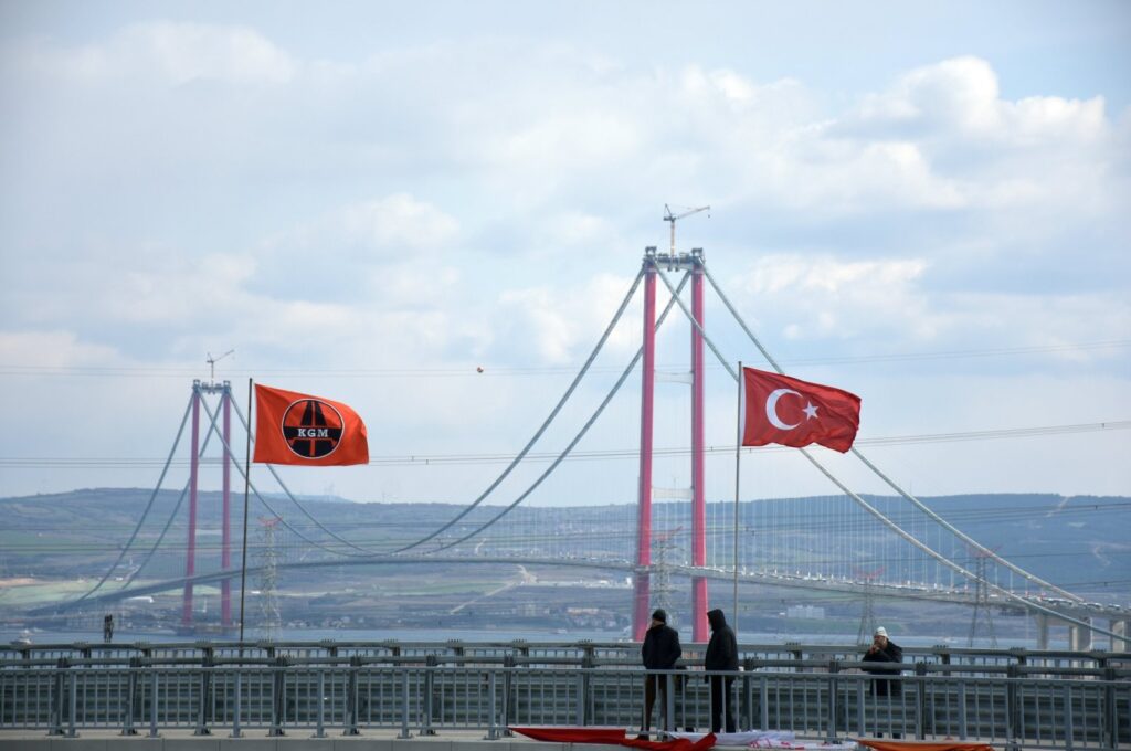 People take photos of the 1915 Çanakkale Bridge, Çanakkale, Türkiye, March 18, 2022. (AA Photo)