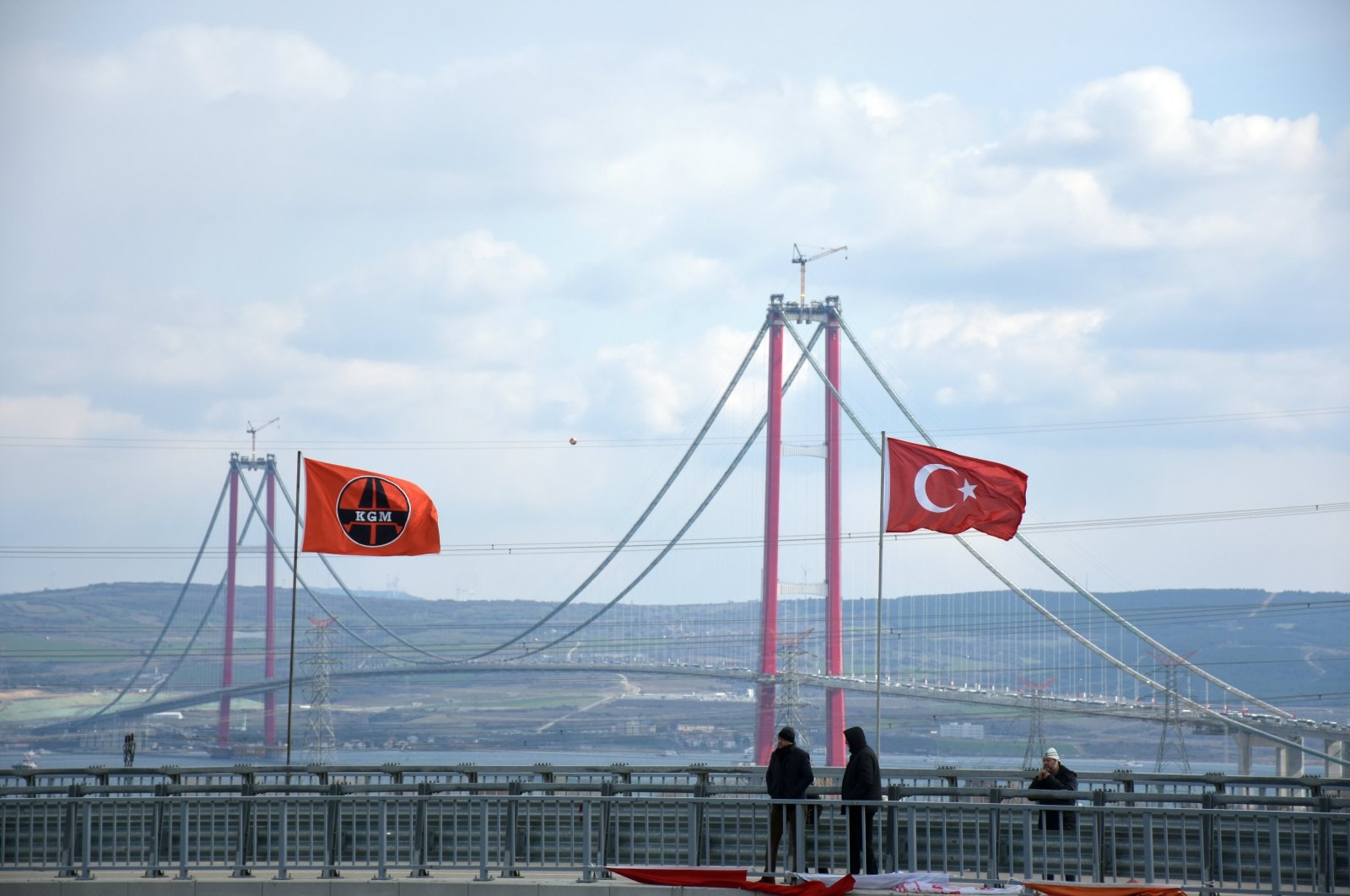 People take photos of the 1915 Çanakkale Bridge, Çanakkale, Türkiye, March 18, 2022. (AA Photo)