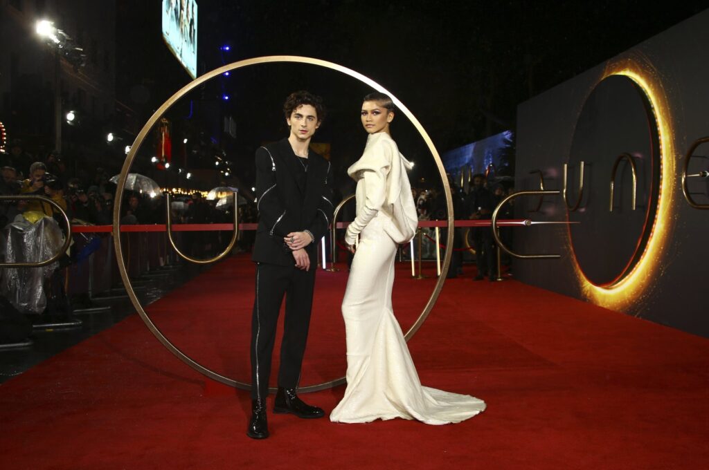 Timothee Chalamet (L) and Zendaya pose for photographers upon arrival at the premiere of the film "Dune," in London, U.K., Oct. 18, 2021. (AP Photo)