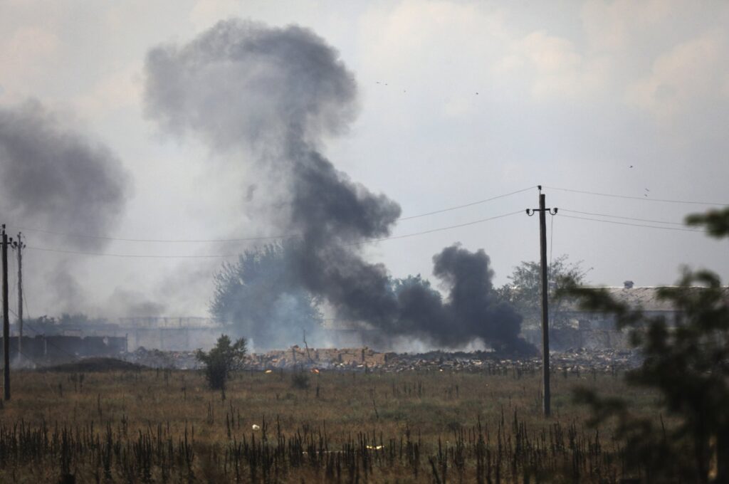 This file photo shows smoke rising over the site of an explosion near the village of Mayskoye, Crimea, Russia occupied Ukraine, Aug. 16, 2022. (AP Photo)