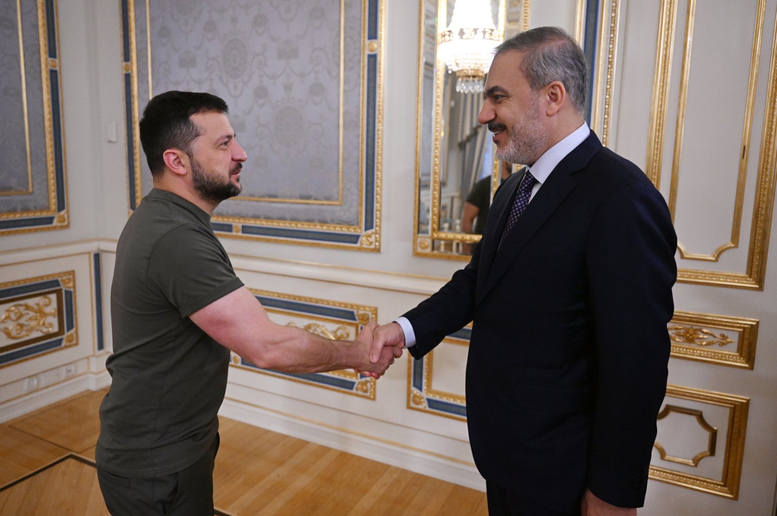 Foreign Minister Hakan Fidan and Ukrainian President Volodymyr Zelenskyy shake hands in Kyiv, Ukraine, Aug. 25, 2023. (AA Photo)