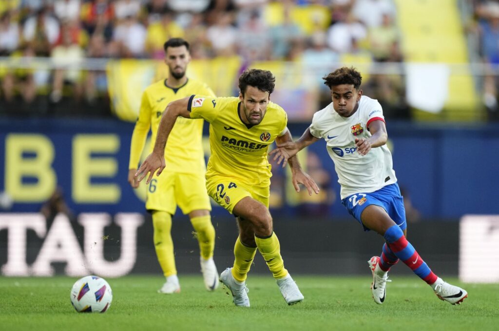 Barcelona's Lamine Yamal (R) and Villarreal's Alfonso Pedraza vie for the ball during the La Liga match at the El Madrigal, Villarreal, Spain, Aug. 27, 2023. (AA Photo)
