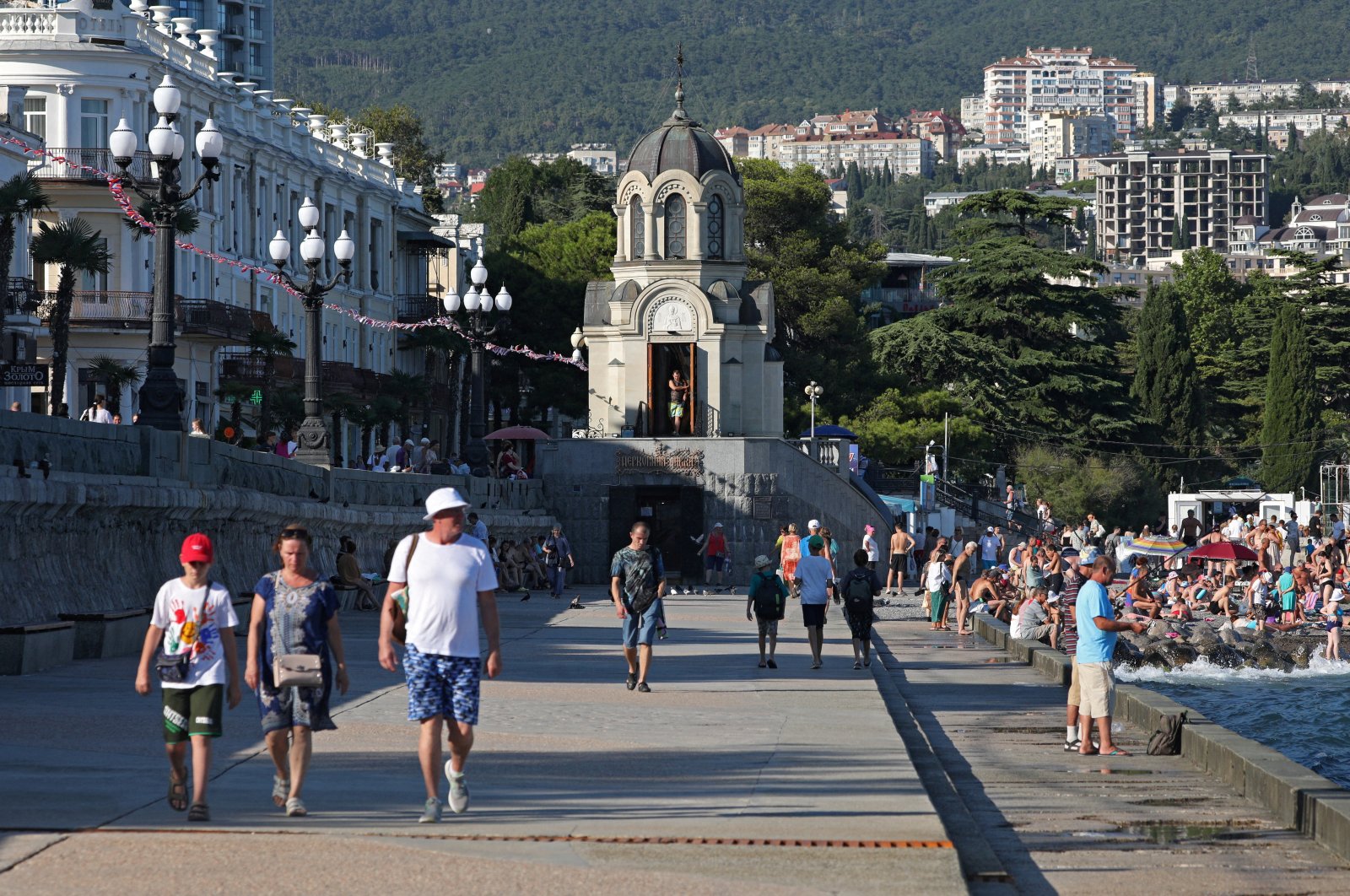 People walk along an embankment in Yalta, Crimea, Ukraine, Aug. 18, 2023. (Reuters Photo)