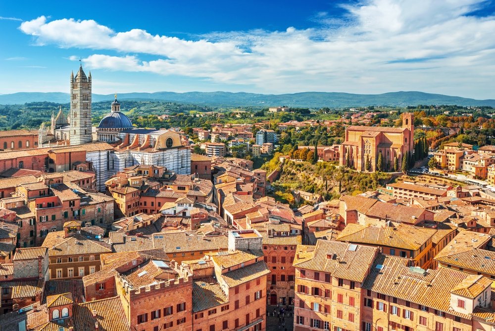 The scenery of Siena, a beautiful medieval town in Tuscany, with a view of the Dome and Bell Tower of Siena Cathedral. (Shutterstock Photo)