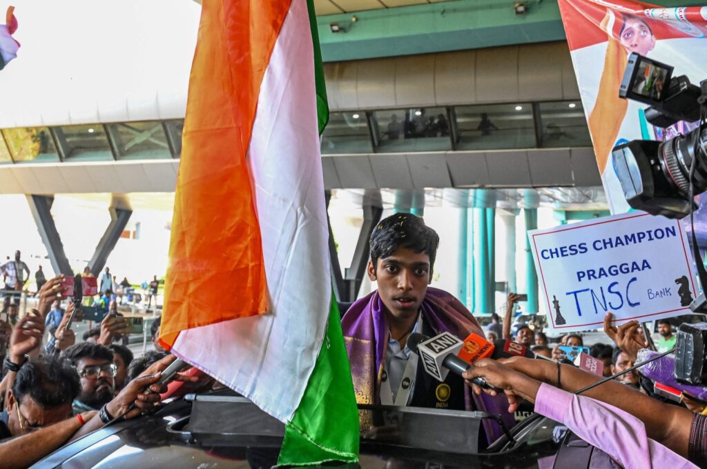 India's chess grandmaster and silver medallist Rameshbabu Praggnanandhaa, responds to a television media personnel as he is welcomed upon his return from the FIDE Chess World Cup in Baku, at the Chennai International airport, Chennai, India, Aug. 30, 2023. (AFP Photo)