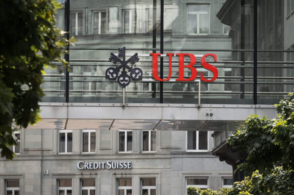 A sign of Swiss giant banking UBS is seen above a sign of Credit Suisse in Zurich, Switzerland, Aug. 30, 2023. (AFP Photo)