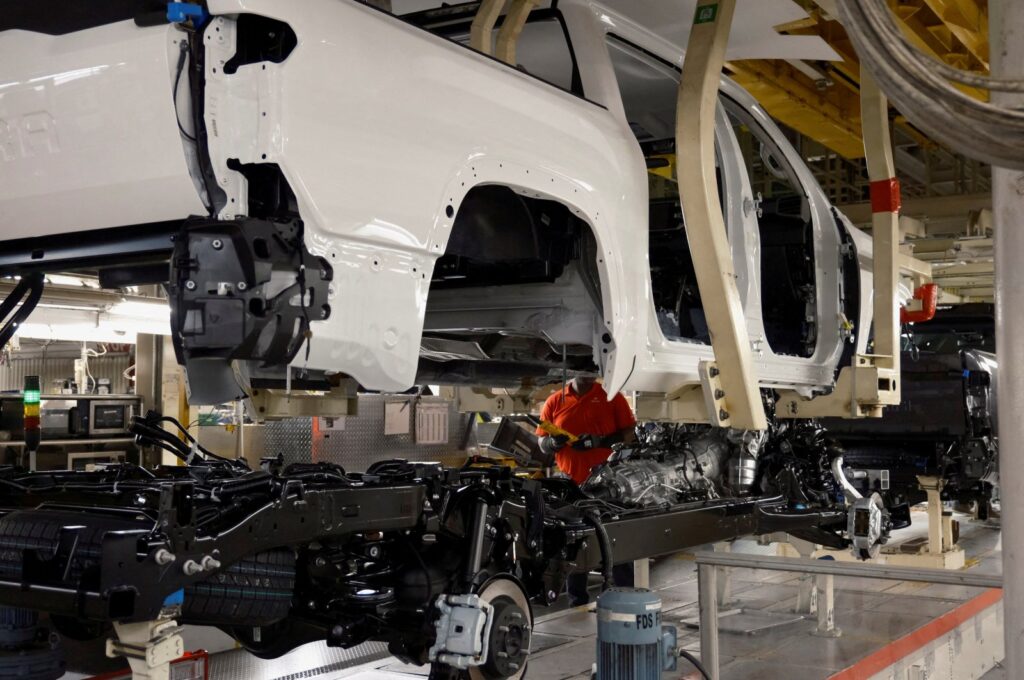 A worker uses a robot to place a Tundra body onto its frame at Toyota's truck plant in San Antonio, Texas, U.S., April 17, 2023. (Reuters Photo)