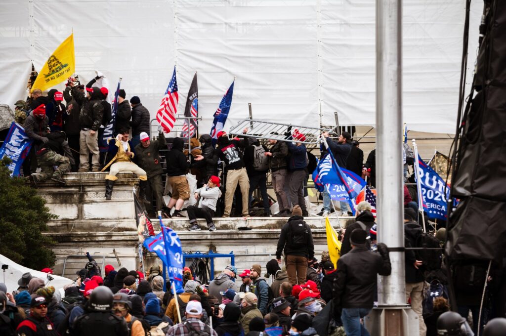 A group of pro-Trump protesters climb the walls of the Capitol Building after storming the West lawn, Washington, DC, Jan. 6, 2021. (Getty Images Photo)